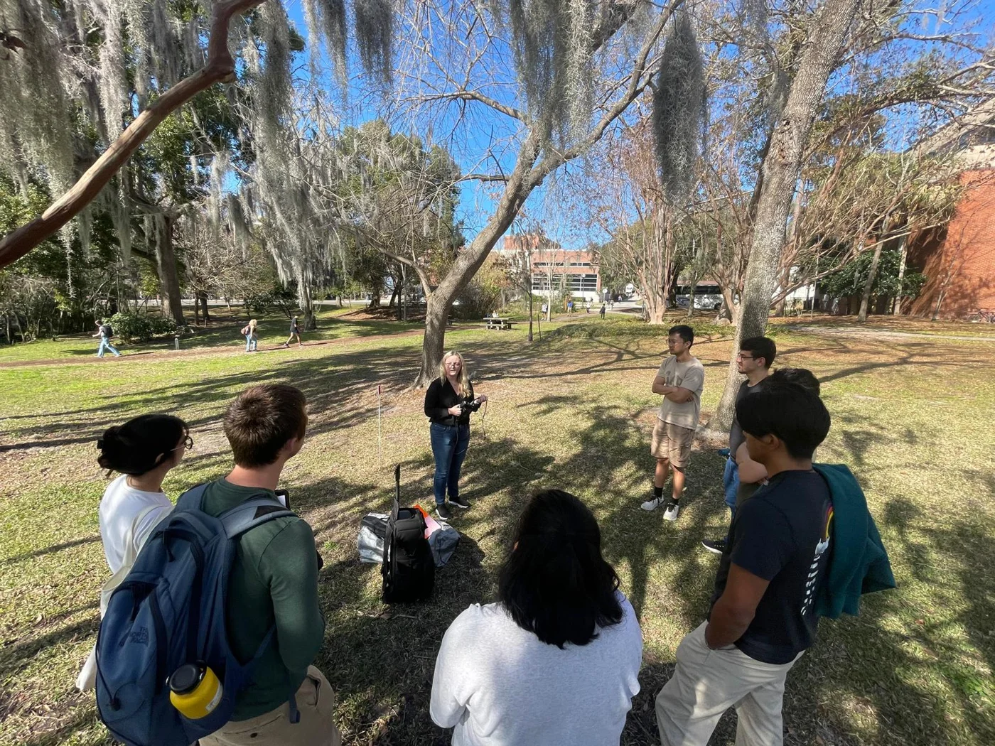 An outdoor demonstration connects participants with forest measurement technology.