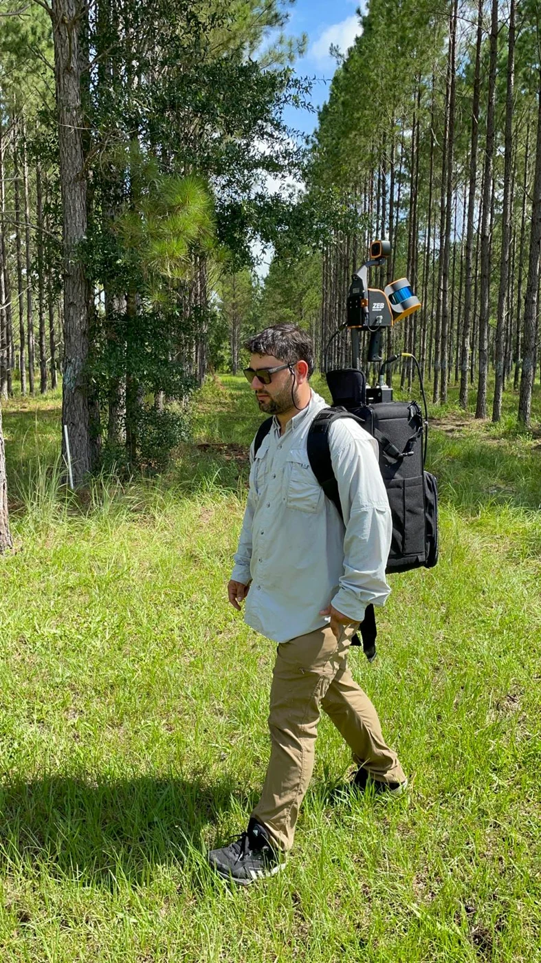 Backpack-mounted ZEB Horizon collecting data in a pine forest